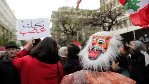 A Lebanese anti-government demonstrator wears an angry tiger mask during a rally in front of the central bank building in the capital Beirut on December 30, 2019. (AFP/ File Photo)