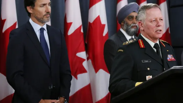 Canadian Prime Minister Justin Trudeau (L), Minister of National Denfence Harjit Sajjan (C) listen as Chief of Defence Staff General Jonathan Vance addresses the media during a news conference January 8, 2020 in Ottawa, Canada. Dave Chan / AFP