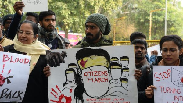 Protesters hold placards at a demonstration against India's new citizenship law in New Delhi on January 9, 2020. Sajjad HUSSAIN / AFP
