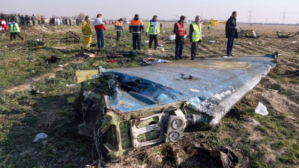 In this file photo taken on January 8, 2020 rescue teams are seen at the scene of a Ukrainian airliner that crashed shortly after take-off near Imam Khomeini airport in the Iranian capital Tehran. Iran said on January 11 that it unintentionally shot down the Ukrainian plane due to 'human error'. Akbar TAVAKOLI / IRNA / AFP