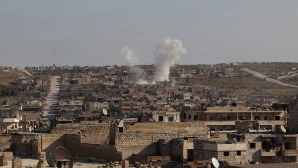 Smoke billows following a reported air strike by pro-regime forces in the town of Maaret Al-Numan in Syria's northwestern Idlib province on January 13, 2020. Abdulaziz KETAZ / AFP