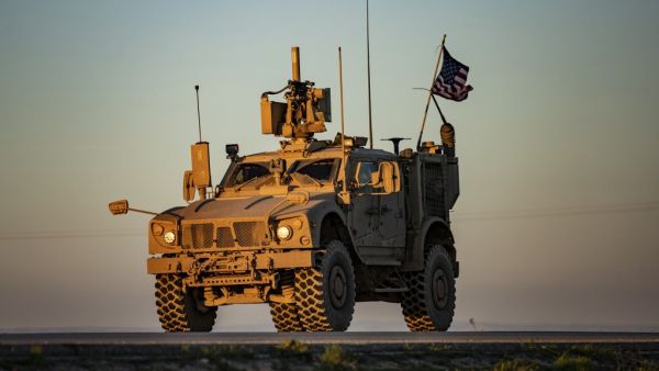 A vehicle part of a US military convoy drives on the outskirts of the Kurdish-controlled northern Syrian city of Qamishli on January 14, 2020. Delil SOULEIMAN / AFP