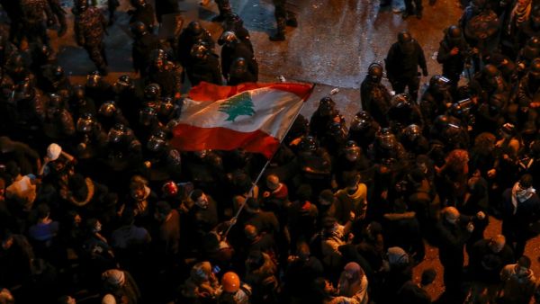 Lebanese anti-government protesters gather at the entrance of a police barracks housing the detainees who were arrested overnight, in the capital Beirut on January 15, 2020. (AFP/ File Photo)