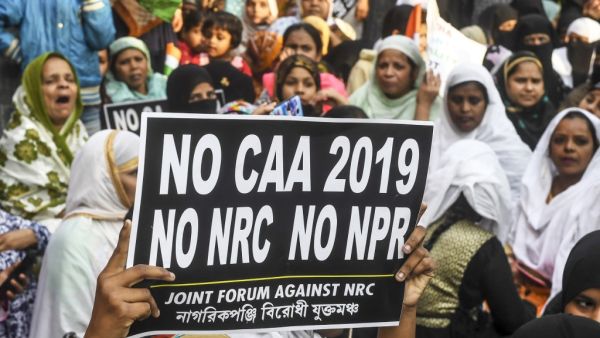 Protesters hold placards as they take part in a demonstration against India's new citizenship law, in Kolkata on January 21, 2020. Dibyangshu SARKAR / AFP