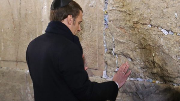 French President Emmanuel Macron prays at the Western Wall, Judaism's holiest prayer site, in Jerusalem's Old City on January 22, 2020. (AFP/ File Photo)