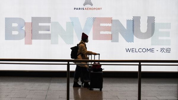 A passenger coming from China, leaves the Terminal wearing a protective face mask after landing in Charles De Gaule Airport on January 26, 2020 in Roissy-en-France. (AFP/ File Photo)