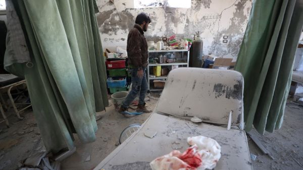 A Syrian man inspects damages in Al-Iman hospital following a reported Russian air strike in the town of Sarjah, northwest of Maaret al-Numan in the northwestern Syrian province of Idlib, on January 26, 2020.(AFP/ File Photo)