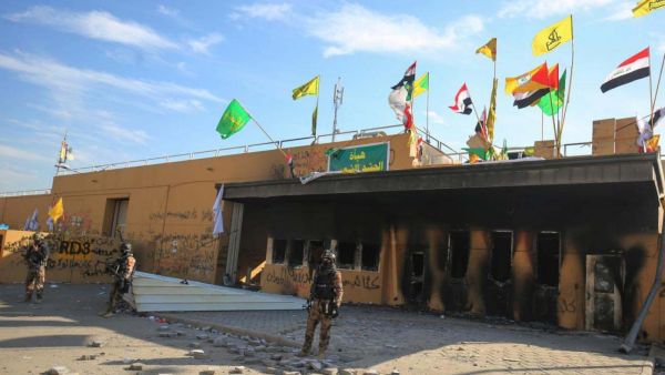 Iraqi security guards US embassy in capital Baghdad on 1 January (AFP)