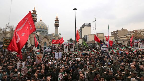Thousands pack the streets in front of Imam Jafar Sadegh Mosque in downtown Tehran on Saturday afternoon many flying the red flag. (AFP/ File Photo)