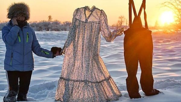 Davydova can be seen holding the clothes, which froze within minutes of being left outdoors, in Yakutia, Siberia last week (dailymail)