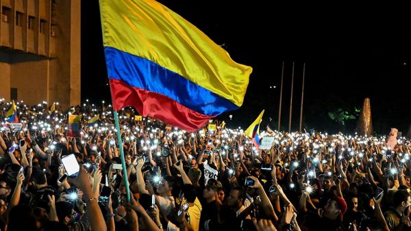 People take part in a protest against the government of Colombia's President Ivan Duque, in Cali, Colombia [Luis Yobayo/AFP] 