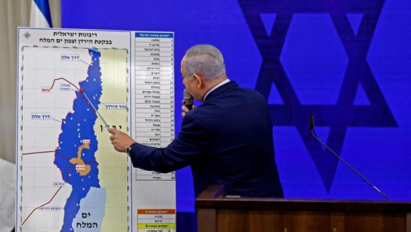Growing appetite for lands. Israeli Prime Minister Binyamin Netanyahu points at a map of the Jordan Valley as he gives a statement in Ramat Gan near Tel Aviv, September 10. (AFP)