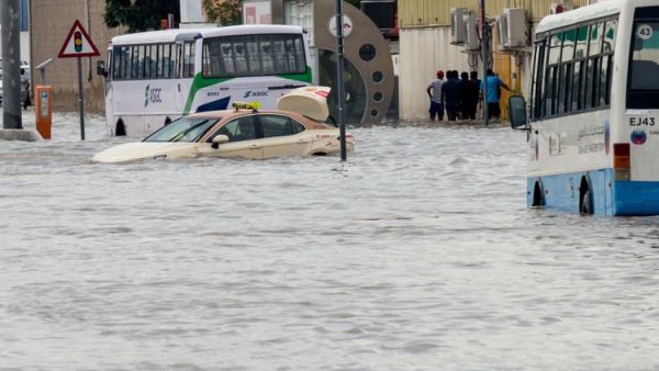 A car was stuck in a flooded tunnel and nearly submerged in water. (Twitter)