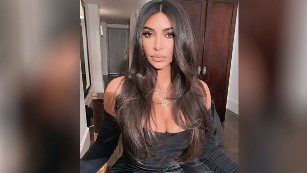  Kim stuck with a reserved white pair of her own Skims shapewear to match her mostly colorless home.