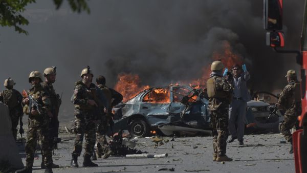 Afghan security forces personnel are seen at the site of a car bomb attack in Kabul on May 31, 2017. (Shah Marai/AFP/Getty Images)