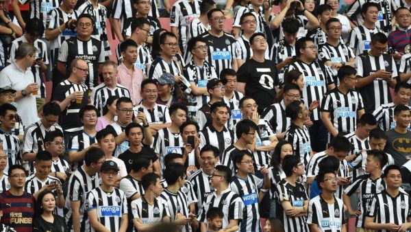 Newcastle United fans look on during their match for third place against West Ham United in the 2019 Premier League Asia Trophy football tournament at the Hongkou Stadium in Shanghai on July 20, 2019. HECTOR RETAMAL / AFP
