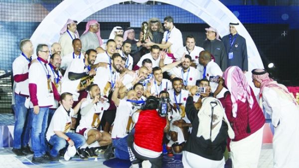  HE Sheikh Joaan bin Hamad al-Thani, the president of the Qatar Olympic Committee, poses with Qatar Handball Association president Ahmed Mohamed al-Shabi and members of the Qatar national team after they won the Asian Handball Championship.