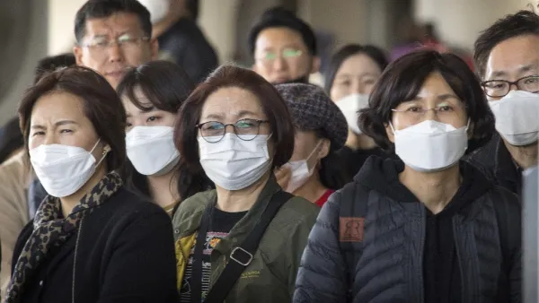 Passengers wear face masks to protect against the spread of the Coronavirus as they arrive on a flight from Asia at Los Angeles International Airport, California, on January 29, 2020. A new virus that has killed more than one hundred people, infected thousands and has already reached the US could mutate and spread, China warned, as authorities urged people to steer clear of Wuhan, the city at the heart of the outbreak.  Mark RALSTON / AFP