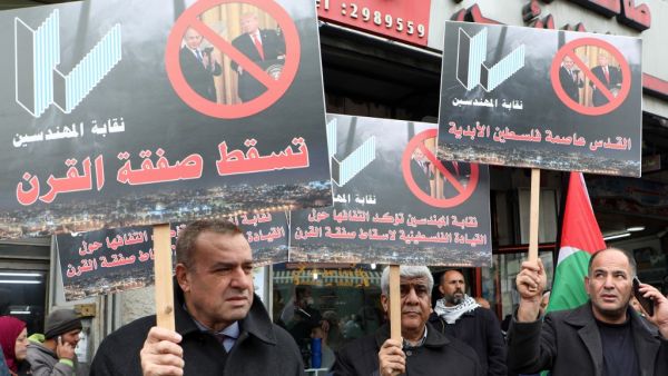 Palestinian protesters hold placards that read in Arabic: "No to the Deal of the Century", as they demonstrate against a US-brokered peace proposal in the West Bank city of Ramallah, on February 11, 2020. AFP
