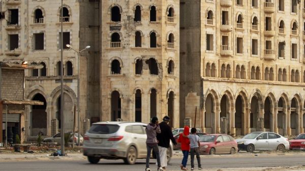 Libyans walk in the eastern Libyan port city of Benghazi on February 13, 2020. Abdullah DOMA / AFP