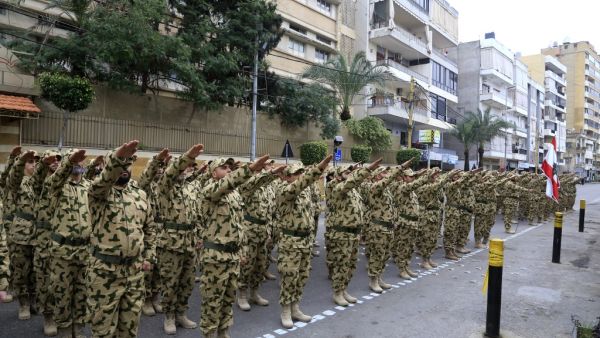 Fighters from the Lebanese Resistance Brigades (Saraya al-Muqawama al-Lubnaniya), a paramilitary group affiliated with Hezbollah, march in the streets of the capital Beirut'ssouthern suburbs to commemorate killed Hezbollah leaders, on February 14, 2020. AFP