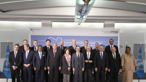 Members of the international committee pose for a family photo during a follow-up meeting on Libya, arranged by German Foreign Minister Heiko Maas (first row, C), on the sidelines of 56th Munich Security Conference (MSC) in Munich, southern Germany, on February 16, 2020: (first row, L-R) Italy's Foreign Minister Luigi Di Maio, Algerian Foreign Minister Sabri Boukadoum, Congolese Foreign Minister Jean-Claude Gakosso, Egyptian Foreign Minister Sameh Shoukry, the Deputy Special Representative of the UN Secreta