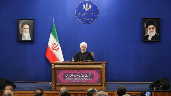 Iranian President Hassan Rouhani speaks during a news conference in the capital Tehran, on February 16, 2020, with the portraits of Iran's (L to R) former and current Supreme Leaders, Ayatollah Ruhollah Khomeini and Ayatollah Ali Khamenei, seen behind. AFP