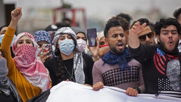 Iraqi students take part in an anti-government protest in the southern city of Basra on February 18, 2020. Since October, the country of 40 million has been rocked by a historically large grassroots movement with big goals: ending corruption, unaccountable sectarian parties and overreach from neighbouring Iran. Hussein FALEH / AFP