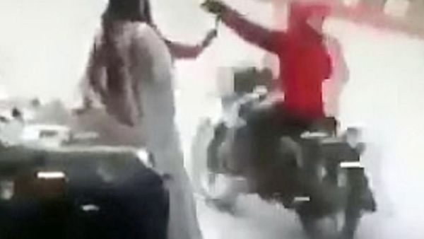 The stunned women look around in confusion as one raises her hand to her mouth before members of staff jog out to help them. (Video Screenshot)