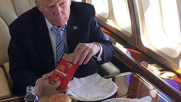 President Trump sings the praises of fast food; he's seen here eating a McDonald's hamburger during the 2016 presidential campaign. (Instagram)