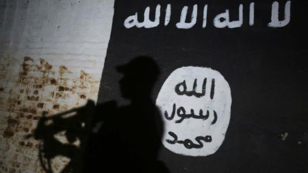 An Iraqi suspected of belonging to IS will face charges of murder and genocide [AFP]