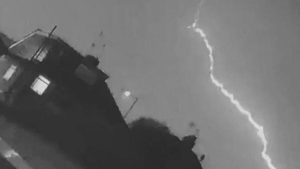 A British man's home security camera captured the moment lightning struck a passenger plane moments after it took off from a nearby airport. (Video Screenshot)