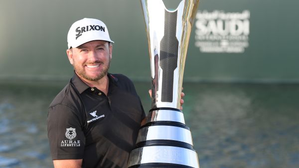 McDowell celebrates with the Saudi International trophy