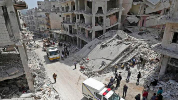 Members of the Syrian Civil Defense search the rubble of a collapsed building following an explosion in the town of Jisr al-Shughuor in Idlib, Syria on April 24, 2019. (AFP)