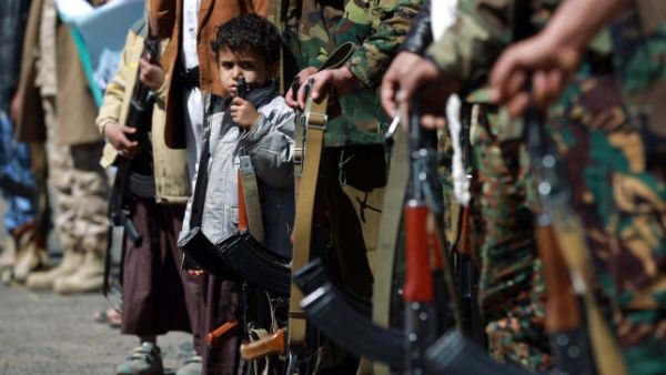 Yemeni children hold automatic rifles as they join grown up relatives in a tribal gathering organised by the Shiite Huthi movement (Picture: MOHAMMED HUWAIS/AFP/Getty Images)