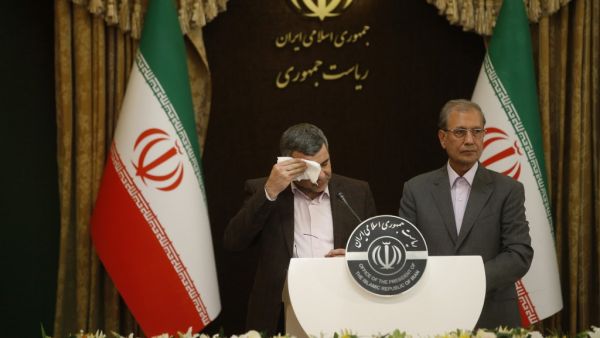 Iranian Deputy Health Minister Iraj Harirchi (L) wipes the sweat off his face, during a press conference with the Islamic republic's government spokesman Ali Rabiei in the capital Tehran on February 24, 2020. AFP/File