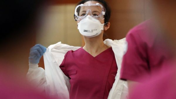 New nurse officers are trained on the COVID-19 coronavirus before heading to Daegu to help medical staff, at the Korea Armed Forces Nursing Academy in Daejeon on March 2, 2020. South Korea confirmed 599 new coronavirus cases on March 2, taking the total to 4,335, health authorities said, while the death toll rose by eight to 26. YONHAP / AFP