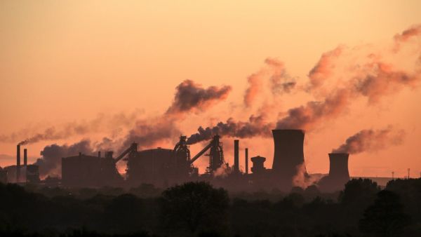 In this file photo taken on May 22, 2019, vapour is pictured rising from British Steel's Scunthorpe plant at dawn in north Lincolnshire, north east England UK manufacturing activity rebounded in February to a ten-month high on easing Brexit uncertainty, but supply chains were nevertheless pressured by coronavirus concerns, data showed on March 2, 2020. The IHS Markit UK Manufacturing purchasing managers' index (PMI) stood at 51.7 last month, the group said in a statement. Lindsey Parnaby / AFP
