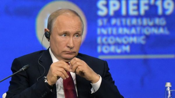 In this file photo taken on June 07, 2019 Russian President Vladimir Putin attends a plenary session of the St. Petersburg International Economic Forum (SPIEF) in Saint Petersburg. Russia will not hold its main business showcase, the Saint Petersburg International Economic Forum, in June due to the novel coronavirus outbreak, the head of its organising committee said on March 5, quoted by Russian news agencies. Olga MALTSEVA / AFP
