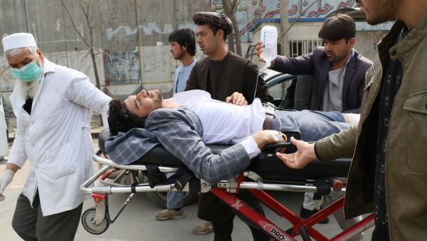 An injured man is brought on a stretcher to an ambulance following a gun attack during an event to mark the 25th anniversary of death of Shiite leader Abdul Ali Mazari, In Kabul on March 6, 2020. At least 27 people were killed in an attack on a political rally in Kabul on March 6, officials said, in the deadliest assault in Afghanistan since the US signed a withdrawal deal with the Taliban. STR / AFP