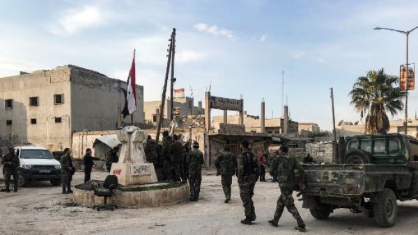 Syrian army soldiers gather with vehicles in a square in the town of Saraqib in the northwestern Idlib province on March 6, 2020, as government forces assumed control over it. AFP