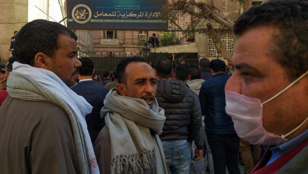 Egyptians bound for GCC countries gather in front of the Central Public Health Laboratories in downtown Cairo as they wait to get tested for coronavirus (COVID-19) on March 8, 2020. Khaled DESOUKI / AFP