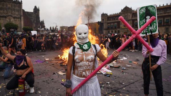 A woman poses for a photo while taking part in a protest during the International Women's Day, in Mexico City, on March 8, 2020. Women around the globe are taking action to mark International Women's Day and to push for action to obtain equality. VICTORIA RAZO / AFP