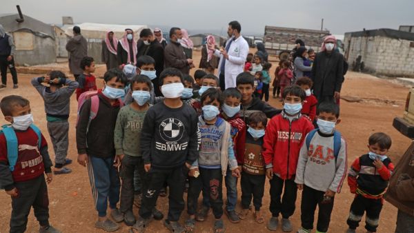 Doctor Ali Ghazal holds an awareness workshop on Coronavirus (COVID-19) at a camp for displaced people in Atme town in Syria's northwestern Idlib province, near the border with Turkey, on March 14, 2020. AAREF WATAD / AFP`