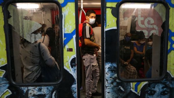People travel on the subway wearing protective masks as a preventive measure in the face of the global COVID-19 coronavirus pandemic, in Caracas, on March 14, 2020. AFP/ File