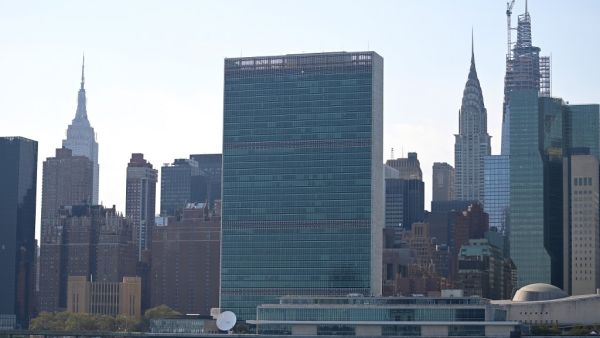 In this file photo a New York Police Department boat is seen on the East River in front of the UN headquarters building in downtown Manhattan on 2019 in New York City. At the normally busy headquarters of the United Nations in New York, life is suddenly moving at slow speed -- very slow speed. Johannes EISELE / AFP