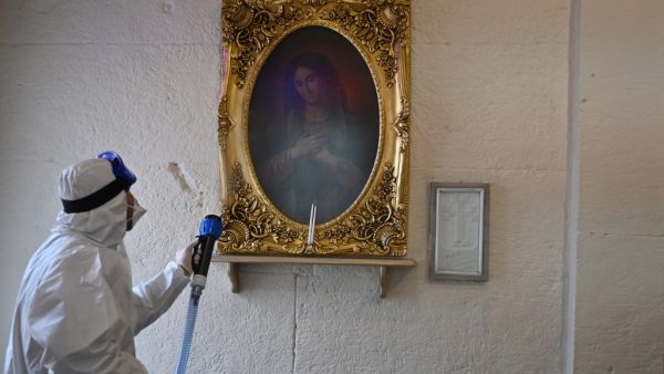 Members of Istanbul's Metropolitan Municipality disinfects the Surp Stephanos Armenian Church in Istanbul to prevent the spread of the COVID-19, the novel coronavirus on March 15, 2020. AFP