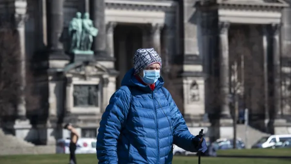 A man wearing a surgical mask walks past Berlin's Cathedral (Berliner Dom) in Berlin on March 17, 2020. John MACDOUGALL / AFP