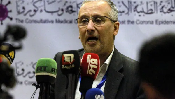 Ahmed al-Hassi, spokesman for the medical committee to combat COVID-19 coronavirus disease in Libya's eastern city of Benghazi, speaks during a press conference on March 20, 2020 announcing updates on figures for suspected cases. Abdullah DOMA / AFP