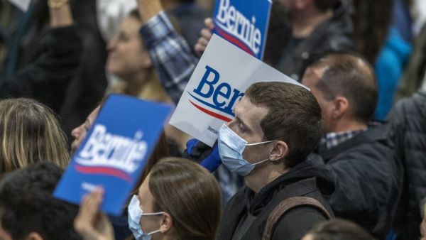 Supporters wear medical masks, as fears of coronavirus increase in California, during a campaign rally for Presidential candidate Sen. Bernie Sanders at the Los Angeles Convention Center on March 1, 2020 in Los Angeles, California. AFP/File